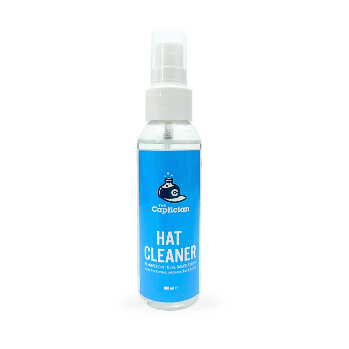 Bottle of hat cleaner with blue label on a white background
