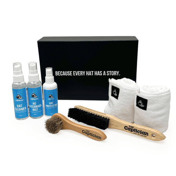 Hat care product set with bottles, brush, and cloths in front of a black box with text.